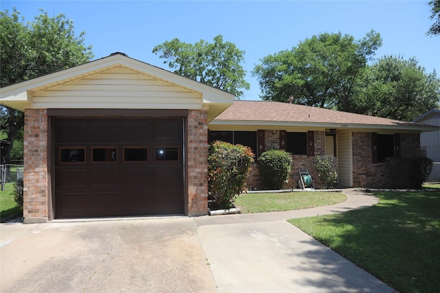 3104 Bonham Dr, Bryan, TX 77803 - single story home featuring brick siding, driveway, a front yard, and a garage
