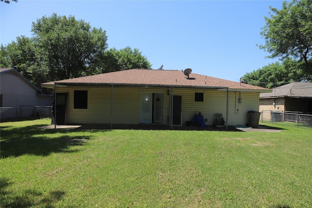 3104 Bonham Dr, Bryan, TX 77803 - rear view of property with fence and a yard