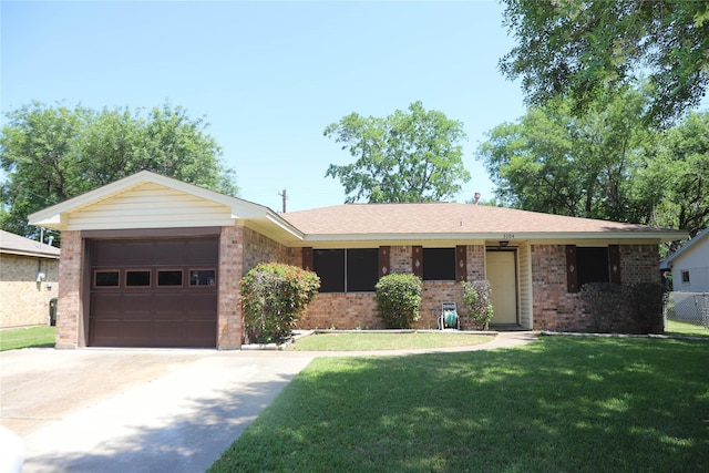 3104 Bonham Dr, Bryan, TX 77803 - single story home featuring brick siding, an attached garage, a front yard, and concrete driveway