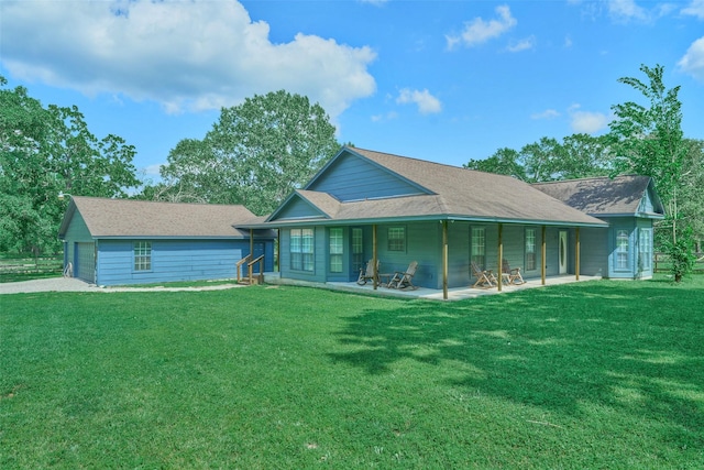 27548 N Log Cabin Rd, Montgomery, TX 77356 - back of house featuring a lawn, a garage, and driveway