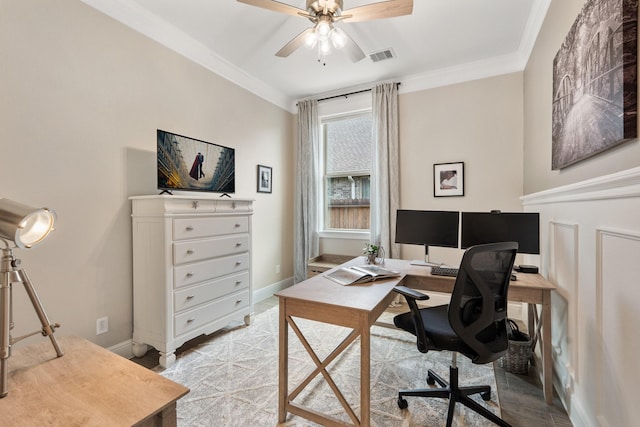 office area with baseboards, a ceiling fan, crown molding, and visible vents