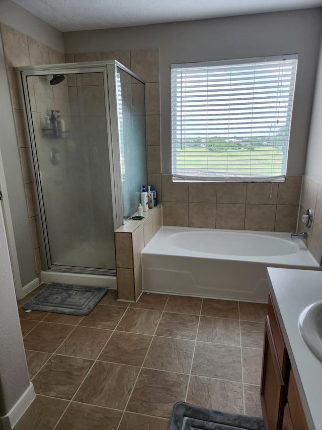 15903 Winston Point Ln, Houston, TX 77084 - bathroom with a stall shower, a garden tub, and vanity