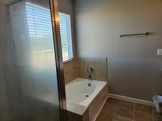 15903 Winston Point Ln, Houston, TX 77084 - full bath featuring tile patterned flooring, baseboards, and a garden tub