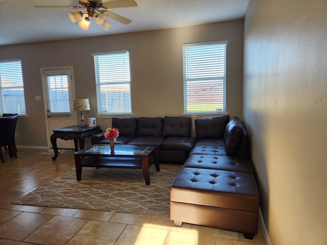 15903 Winston Point Ln, Houston, TX 77084 - living area featuring ceiling fan, baseboards, and tile patterned flooring