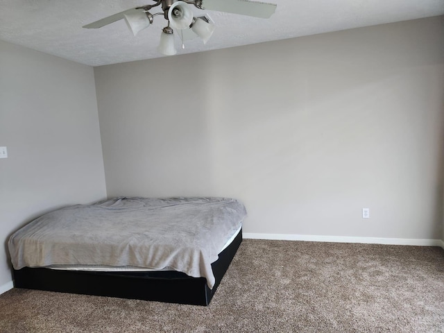 15903 Winston Point Ln, Houston, TX 77084 - carpeted bedroom with baseboards and ceiling fan