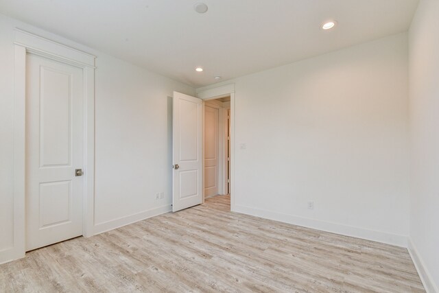 2718 Oakwood Crest Ln, Houston, TX 77018 - unfurnished bedroom featuring baseboards, wood finished floors, and recessed lighting