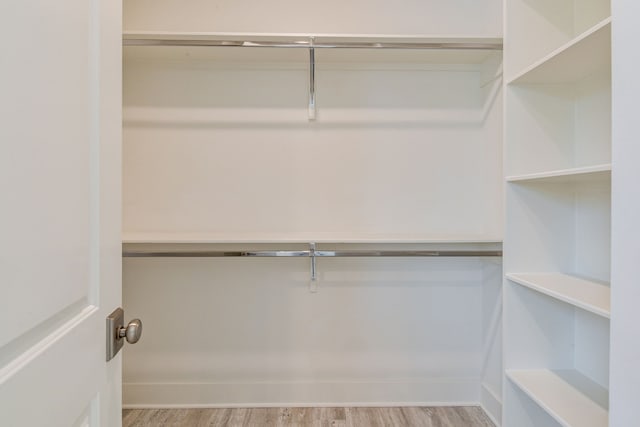 2718 Oakwood Crest Ln, Houston, TX 77018 - walk in closet featuring wood finished floors