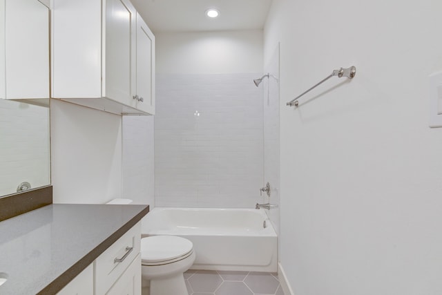 2718 Oakwood Crest Ln, Houston, TX 77018 - bathroom with tile patterned floors, toilet, vanity, baseboards, and bathtub / shower combination
