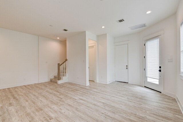 2718 Oakwood Crest Ln, Houston, TX 77018 - spare room with recessed lighting, stairs, visible vents, and light wood-style floors