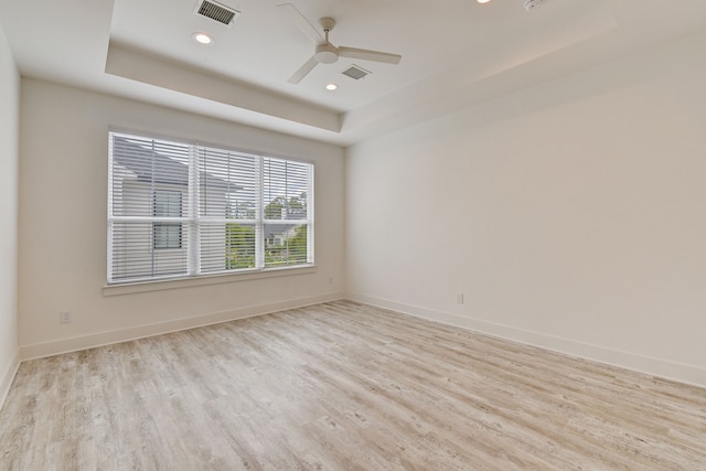 2718 Oakwood Crest Ln, Houston, TX 77018 - unfurnished room with ceiling fan, wood finished floors, visible vents, and a raised ceiling