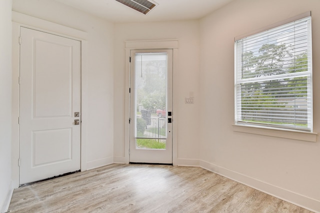 2718 Oakwood Crest Ln, Houston, TX 77018 - doorway to outside featuring light wood finished floors and baseboards