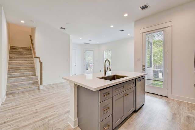 2718 Oakwood Crest Ln, Houston, TX 77018 - kitchen featuring stainless steel dishwasher, gray cabinetry, a sink, and visible vents
