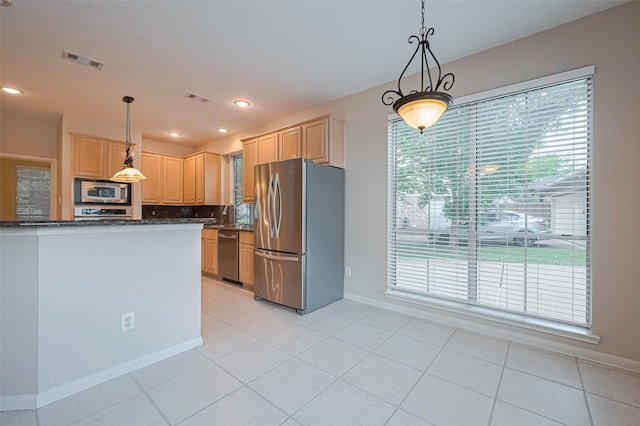 4530 Lakeside Meadow Dr, Missouri City, TX 77459 - kitchen featuring stainless steel appliances, a sink, light tile patterned flooring, tasteful backsplash, and recessed lighting