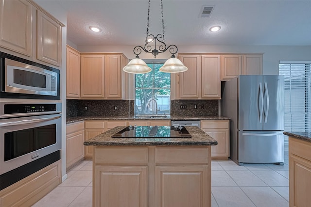 4530 Lakeside Meadow Dr, Missouri City, TX 77459 - kitchen featuring stainless steel appliances, light brown cabinetry, light tile patterned flooring, a sink, and backsplash