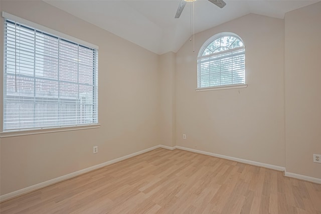 4530 Lakeside Meadow Dr, Missouri City, TX 77459 - spare room featuring light wood-type flooring, vaulted ceiling, ceiling fan, and baseboards