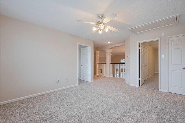 4530 Lakeside Meadow Dr, Missouri City, TX 77459 - empty room with ceiling fan, attic access, light carpet, baseboards, and arched walkways