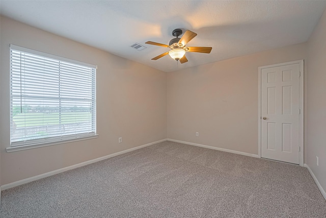 4530 Lakeside Meadow Dr, Missouri City, TX 77459 - empty room with a ceiling fan, carpet floors, and baseboards
