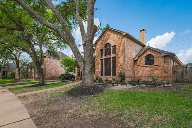 4530 Lakeside Meadow Dr, Missouri City, TX 77459 - view of front of property with brick siding and a chimney
