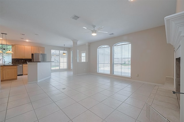 4530 Lakeside Meadow Dr, Missouri City, TX 77459 - unfurnished living room featuring light tile patterned flooring, ceiling fan, and baseboards