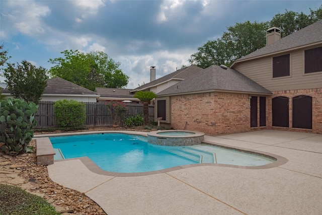 4530 Lakeside Meadow Dr, Missouri City, TX 77459 - view of swimming pool with a patio area, fence, and a pool with connected hot tub