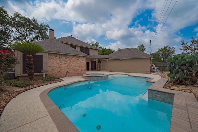 4530 Lakeside Meadow Dr, Missouri City, TX 77459 - view of swimming pool with a pool with connected hot tub and a patio area