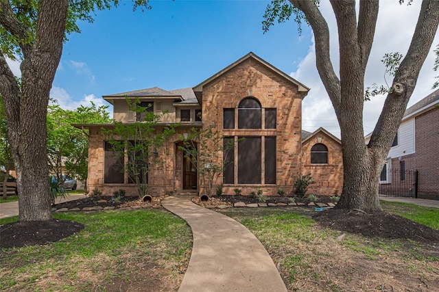 4530 Lakeside Meadow Dr, Missouri City, TX 77459 - view of front of house featuring brick siding, a front yard, and roof with shingles