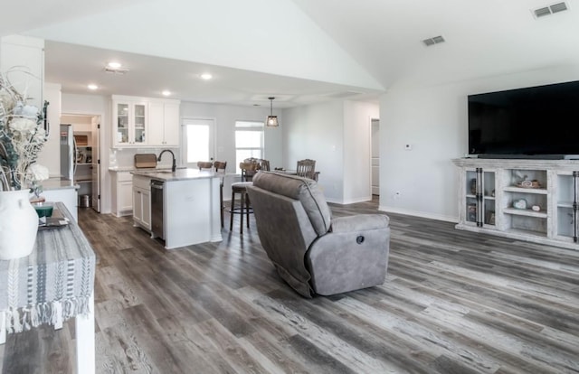 418 E St, East Bernard, TX 77435 - living room with vaulted ceiling, visible vents, recessed lighting, and dark wood finished floors