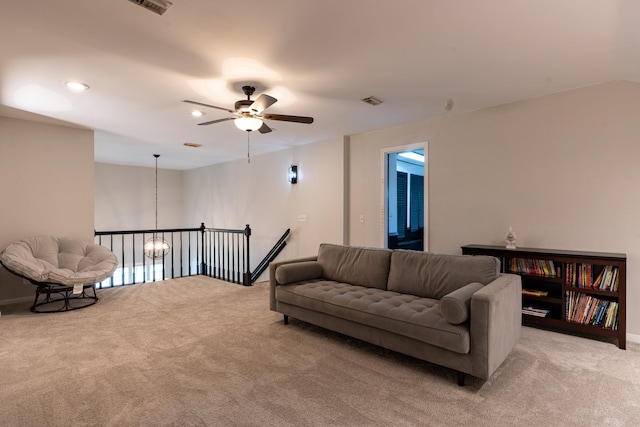 living room with recessed lighting, ceiling fan, light carpet, and baseboards