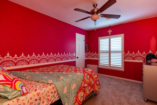 bedroom featuring baseboards, a ceiling fan, and carpet