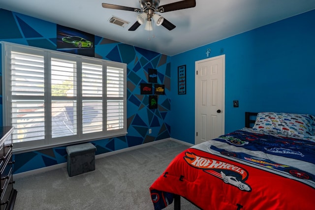 bedroom featuring baseboards, visible vents, ceiling fan, and carpet flooring