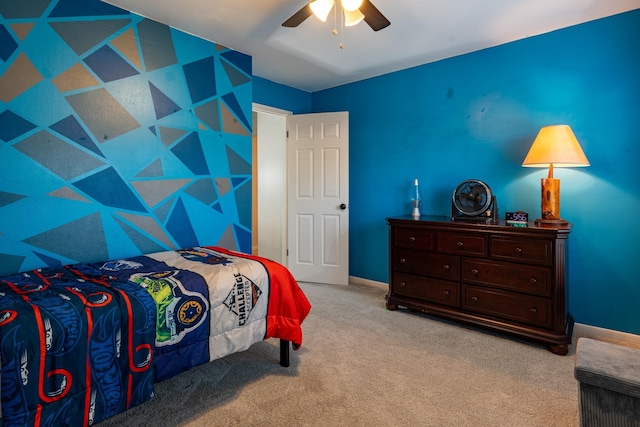 bedroom featuring carpet floors, a ceiling fan, and baseboards