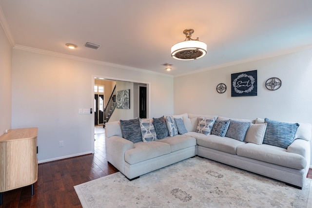 living area featuring stairway, visible vents, hardwood / wood-style floors, and ornamental molding