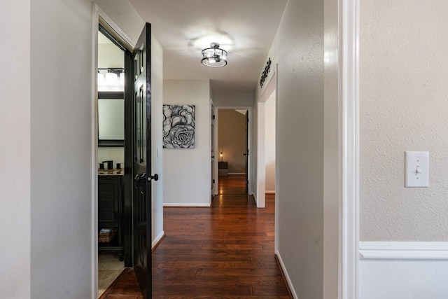 hall featuring dark wood-type flooring