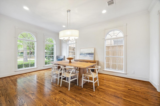 dining area featuring ornamental molding, wood finished floors, visible vents, and recessed lighting