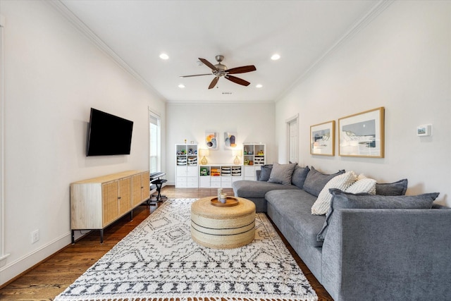living area featuring dark wood-type flooring, crown molding, ceiling fan, and recessed lighting