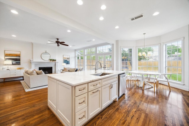 kitchen with visible vents, stainless steel dishwasher, a healthy amount of sunlight, and a sink