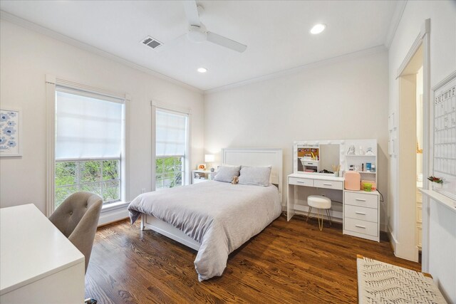 bedroom with dark wood-style floors, ornamental molding, visible vents, and recessed lighting