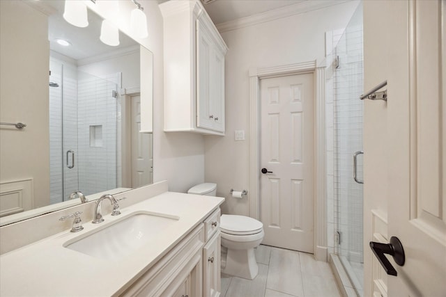 full bathroom featuring toilet, crown molding, vanity, and a stall shower