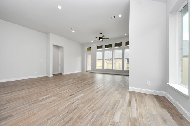 unfurnished living room with ceiling fan, recessed lighting, visible vents, and light wood-style floors