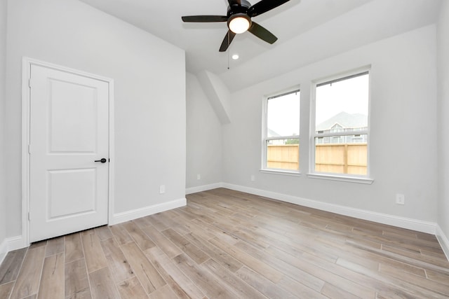 empty room featuring light wood-style floors, baseboards, ceiling fan, and recessed lighting