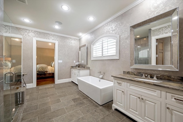ensuite bathroom with ornamental molding, connected bathroom, a bath, tile patterned floors, and a sink