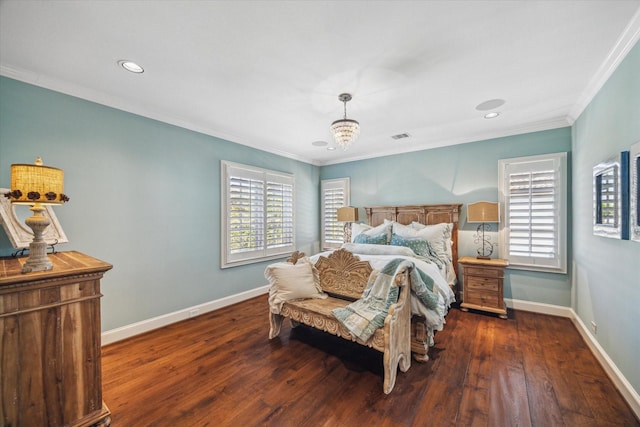 bedroom with an inviting chandelier, multiple windows, and hardwood / wood-style flooring