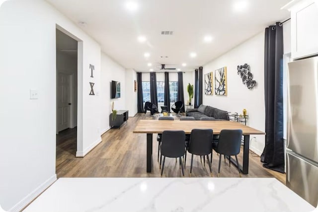2205 Rosewood St, Houston, TX 77004 - dining room featuring wood finished floors, ceiling fan, baseboards, visible vents, and recessed lighting