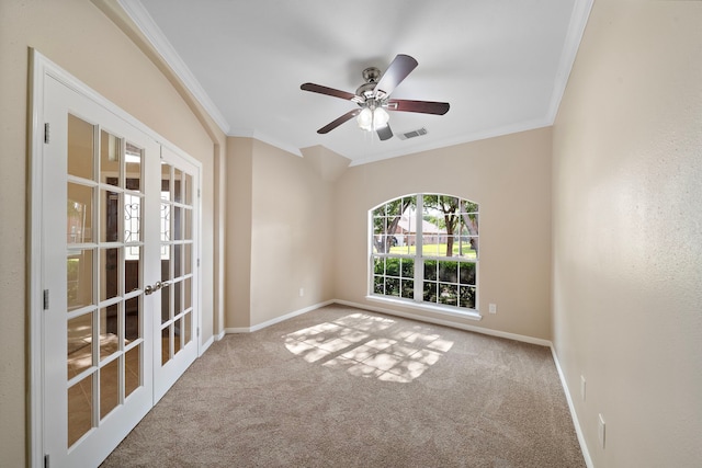 empty room with ornamental molding, visible vents, french doors, and carpet floors