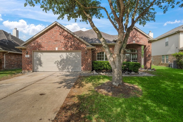 view of front facade with driveway, a front yard, an attached garage, and brick siding