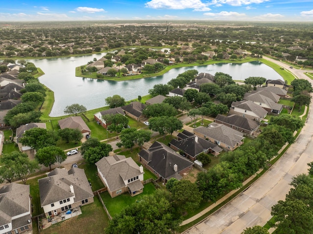 bird's eye view featuring a water view and a residential view