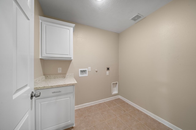 laundry room with hookup for an electric dryer, visible vents, baseboards, hookup for a washing machine, and cabinet space