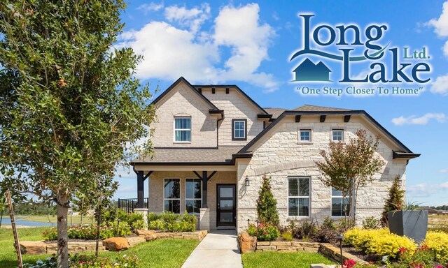 view of front of home featuring stone siding and a shingled roof