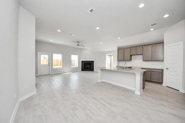 kitchen with baseboards, a ceiling fan, visible vents, and recessed lighting