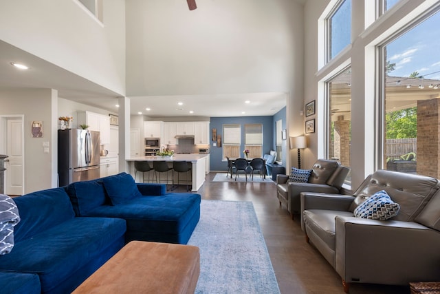 32055 August Woods Way, Conroe, TX 77385 - living room featuring a high ceiling, recessed lighting, and dark wood finished floors